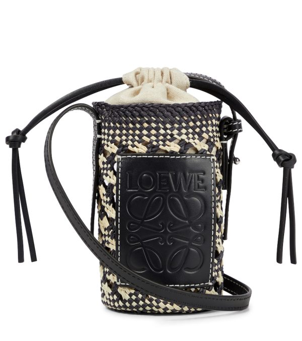 Cylinder leather-trimmed raffia crossbody bag